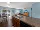 Bright and airy kitchen featuring a center island with seamless flow to the dining and living areas at 5809 71St E St, Palmetto, FL 34221