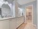 Bright bathroom features double sink vanity, ample storage, and a separate toilet area at 6517 Approach Rd # 57, Sarasota, FL 34238