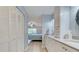 Bathroom view leading to bedroom, showing vanity, closet, and floor at 6517 Approach Rd # 57, Sarasota, FL 34238