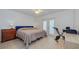 Bedroom with wood floors, French doors, and bike at 6517 Approach Rd # 57, Sarasota, FL 34238