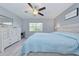 Comfortable bedroom with a fan, dresser, and window at 6517 Approach Rd # 57, Sarasota, FL 34238