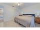 Bedroom boasts wood floors, closet, and ensuite at 6517 Approach Rd # 57, Sarasota, FL 34238
