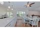 Spacious kitchen featuring granite countertops and a dining area with bright natural light at 6517 Approach Rd # 57, Sarasota, FL 34238