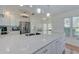 Modern kitchen featuring a large island, stainless steel appliances, and ample cabinet space at 6517 Approach Rd # 57, Sarasota, FL 34238