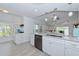 Bright kitchen with white cabinets, granite counters, and an open layout for easy entertaining at 6517 Approach Rd # 57, Sarasota, FL 34238