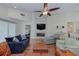 Comfortable living room with hardwood floors, a fireplace, and open layout at 6517 Approach Rd # 57, Sarasota, FL 34238