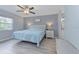 Calming main bedroom featuring a large bed, soft lighting, and muted grey walls at 6517 Approach Rd # 57, Sarasota, FL 34238