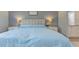 Comfortable main bedroom with soft lighting, neutral colors, and bedside tables at 6517 Approach Rd # 57, Sarasota, FL 34238