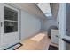 Back patio features tile flooring, a skylight, and access to the house and backyard at 6517 Approach Rd # 57, Sarasota, FL 34238