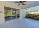 A covered patio features tile flooring and sliding glass doors leading to the outdoors at 6517 Approach Rd # 57, Sarasota, FL 34238