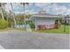 View of the community pool house with well maintained landscaping at 6517 Approach Rd # 57, Sarasota, FL 34238