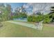 Shuffleboard court next to the pool and lush landscaping in this active community at 6517 Approach Rd # 57, Sarasota, FL 34238