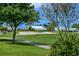 Beautifully landscaped golf course with mature trees, lush green fairways, and view of the community homes beyond the sand traps at 6524 Fairway Gardens Dr # 6524, Bradenton, FL 34203