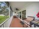 Relaxing screened lanai with comfortable seating, a ceiling fan, and views of the lush yard at 6524 Fairway Gardens Dr # 6524, Bradenton, FL 34203