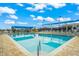 The community pool is offering a refreshing escape with plenty of lounge chairs and shaded areas for relaxation and enjoyment at 6524 Fairway Gardens Dr # 6524, Bradenton, FL 34203