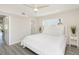 Bright bedroom with king-size bed and light wood floors at 6798 Sarasea Cir # 4, Sarasota, FL 34242