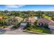 Aerial view featuring well-maintained homes with mature trees and lush landscaping at 8079 36Th Street E Cir, Sarasota, FL 34243