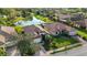 Aerial view showcasing home with mature trees, and landscaping, complete with lake views at 8079 36Th Street E Cir, Sarasota, FL 34243