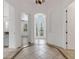 Bright foyer with tiled flooring, arched doorway, and an inviting view through the glass front door at 8079 36Th Street E Cir, Sarasota, FL 34243