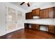 Bright home office features hardwood floors, built in cabinets, and granite countertops at 8079 36Th Street E Cir, Sarasota, FL 34243