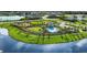 Community pool, playground, and lake view at 8548 Snowfall St, Sarasota, FL 34241