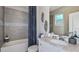 Clean bathroom, featuring a shower/tub combo and white vanity at 8548 Snowfall St, Sarasota, FL 34241
