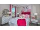 Stylish bedroom with flamingo artwork and white bedding at 8548 Snowfall St, Sarasota, FL 34241