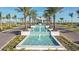 Gated entrance with water feature and lush landscaping at 8548 Snowfall St, Sarasota, FL 34241