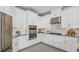 Spacious kitchen with white cabinets, granite countertops, and stainless steel appliances at 8548 Snowfall St, Sarasota, FL 34241
