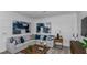 Comfortable living room featuring a sectional sofa and wood accents at 8548 Snowfall St, Sarasota, FL 34241