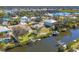 A beautiful waterfront community boasting many waterfront homes, each with private docks and boat lifts on a wide canal at 907 Garland Ave, Nokomis, FL 34275