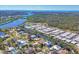 Panoramic aerial showcasing a waterfront community near lush greenery and the ocean at 907 Garland Ave, Nokomis, FL 34275