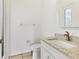 Powder room with single sink and granite countertops at 907 Garland Ave, Nokomis, FL 34275