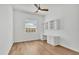 This bright bedroom can also serve as an office, thanks to the built-in desk and shelving unit at 907 Garland Ave, Nokomis, FL 34275
