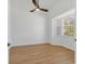 Bright, airy bedroom featuring wood floors and a large window with blinds at 907 Garland Ave, Nokomis, FL 34275