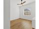 Cozy bedroom with wood floors, a window, and ample natural light at 907 Garland Ave, Nokomis, FL 34275