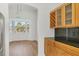 Bright dining room with hardwood floors, bay window, and modern light fixture at 907 Garland Ave, Nokomis, FL 34275