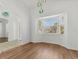 Bright dining room featuring wood floors, a bay window and modern light fixtures at 907 Garland Ave, Nokomis, FL 34275