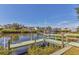 Waterfront property featuring a private dock with boat lift access to a tranquil canal, perfect for boating enthusiasts at 907 Garland Ave, Nokomis, FL 34275