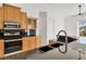 Close-up of kitchen with stainless steel appliances, granite countertops, and double basin sink at 907 Garland Ave, Nokomis, FL 34275