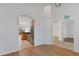 Open-concept living room with archways leading to the kitchen and entryway at 907 Garland Ave, Nokomis, FL 34275