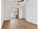 Open living room with hardwood floors leading to an outdoor patio at 907 Garland Ave, Nokomis, FL 34275