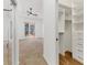 View of the main bedroom featuring an ensuite bathroom and a large walk-in closet at 907 Garland Ave, Nokomis, FL 34275