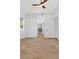 Large main bedroom boasts neutral carpet, ceiling fan and access to the en-suite bath at 907 Garland Ave, Nokomis, FL 34275