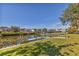 Waterfront property boasts a private dock and serene water views, perfect for boating enthusiasts at 907 Garland Ave, Nokomis, FL 34275