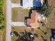 Aerial view of the roof and property, featuring a long driveway, and nearby houses at 1058 Bounds St, Port Charlotte, FL 33952