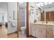 Cozy bathroom featuring a shower, vanity with a sink and storage and a toilet at 1058 Bounds St, Port Charlotte, FL 33952