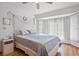 Comfortable bedroom with wood floors, white walls, a large window and coastal decor at 1058 Bounds St, Port Charlotte, FL 33952