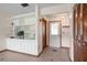 Inviting entryway with tiled floors, a built-in bookshelf, and a coat closet at 1058 Bounds St, Port Charlotte, FL 33952