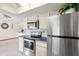 Modern kitchen features stainless steel appliances, ample storage, and stylish finishes at 1058 Bounds St, Port Charlotte, FL 33952
